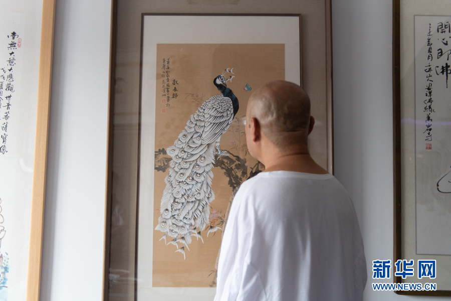 城市相册口足画家黄国富的断臂人生